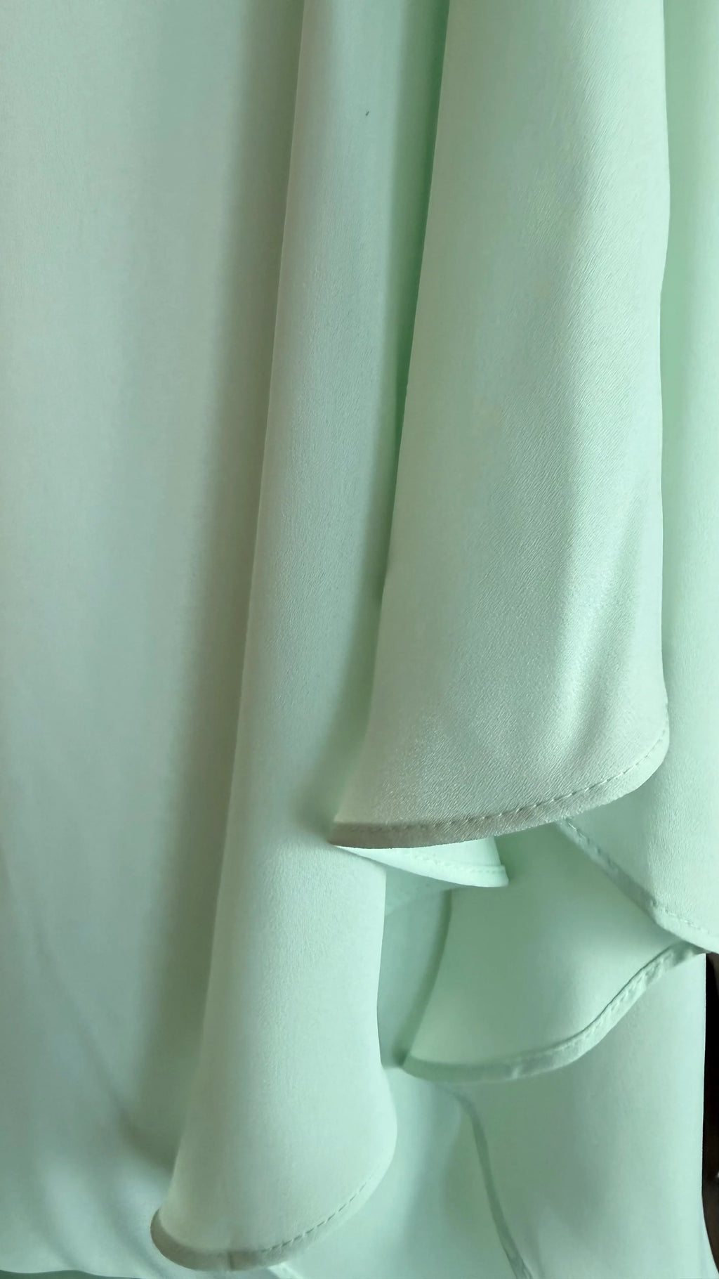 Close-up of light green fabric with a soft texture