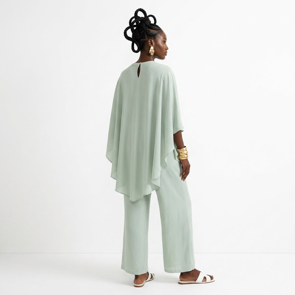 Woman wearing a light green outfit on a white background