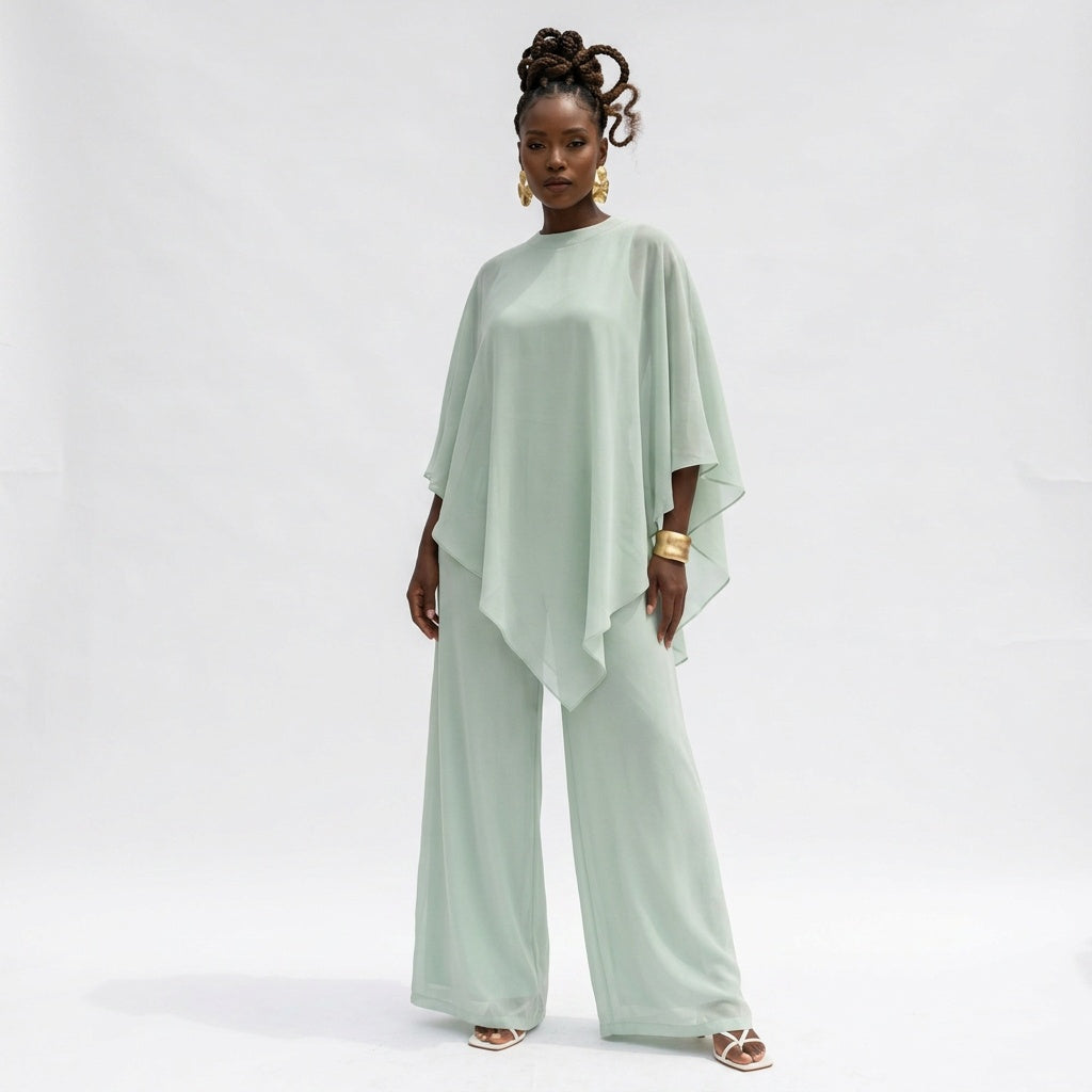 Woman wearing a light green outfit on a white background