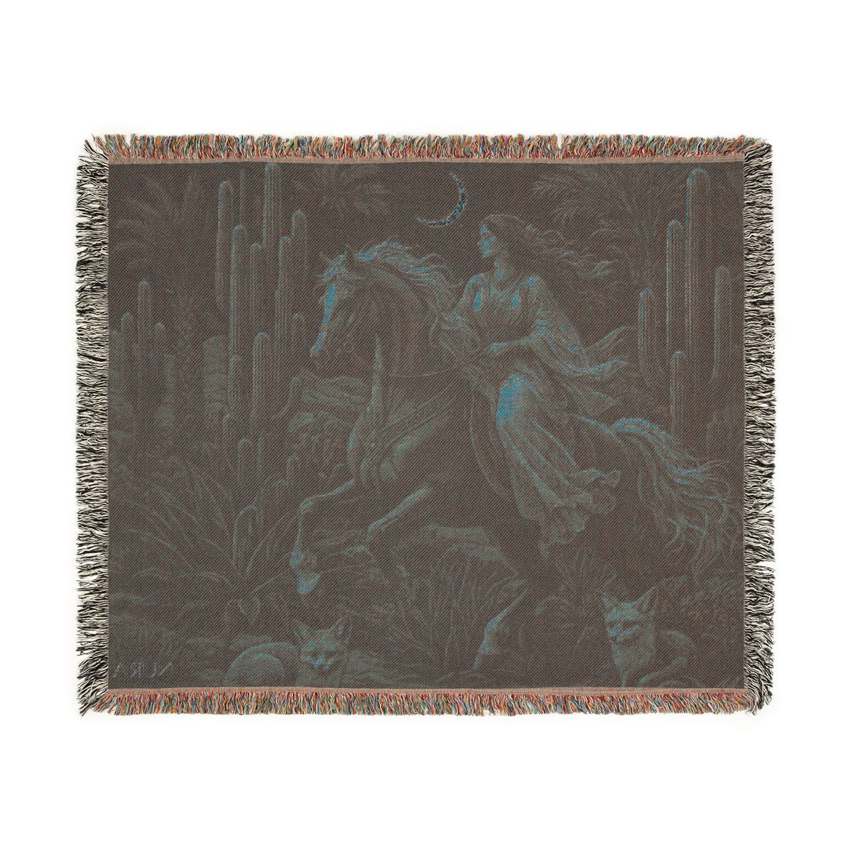 A woven throw blanket featuring a dark fantasy illustration of a woman riding a horse through a desert landscape with cacti, set against a plain white background.