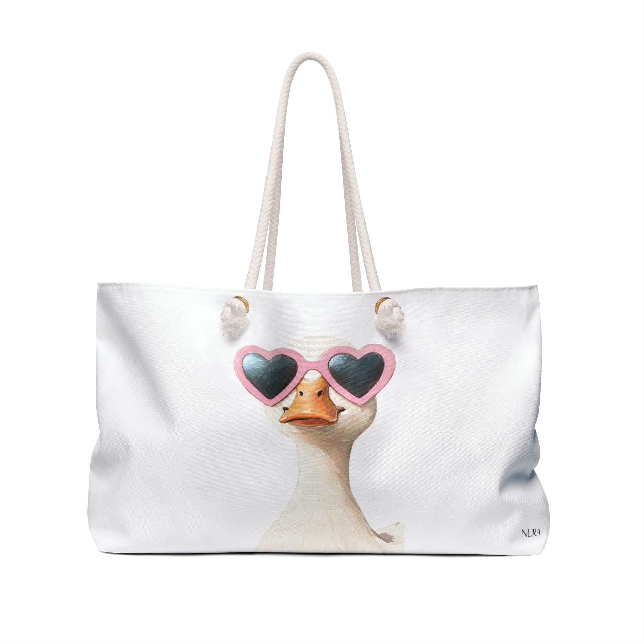 A white canvas tote bag with cream rope handles, featuring a printed illustration of a duck wearing pink heart-shaped sunglasses on the front.